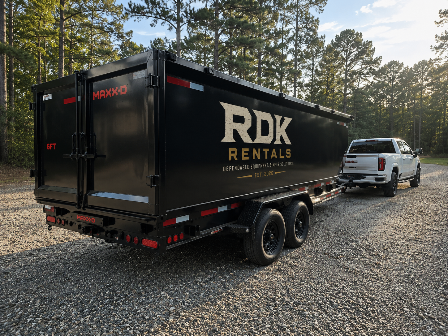 Black roll-off dumpster on a residential driveway